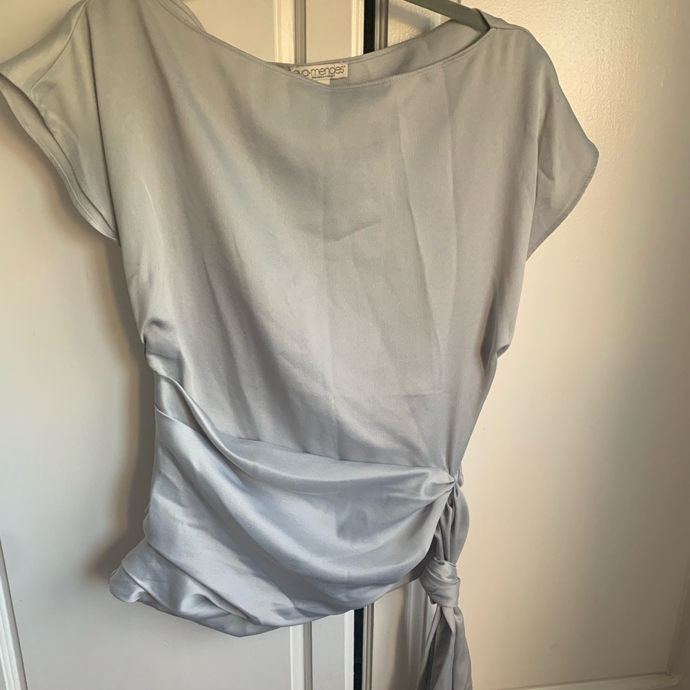 Cap sleeve shirt with long side tail